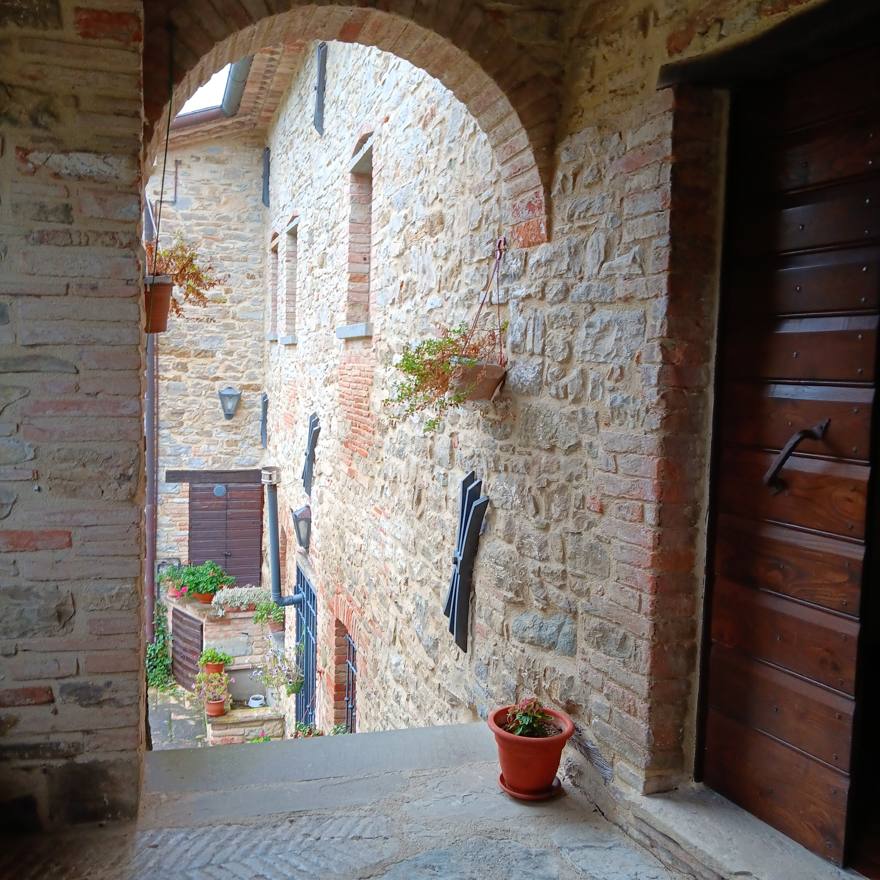 Stone archway looking onto the casale